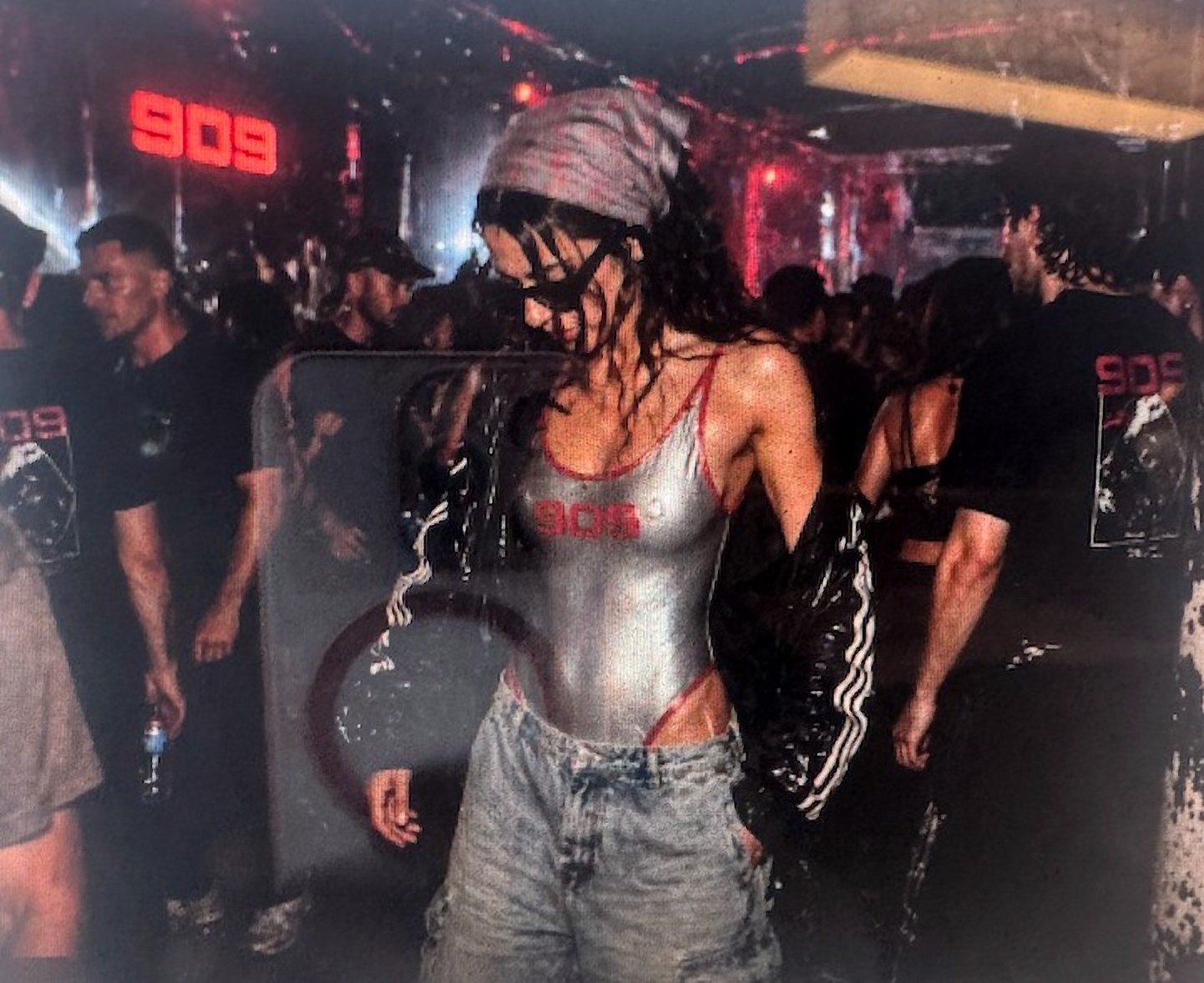 Silver swimsuit in the crowd at 909